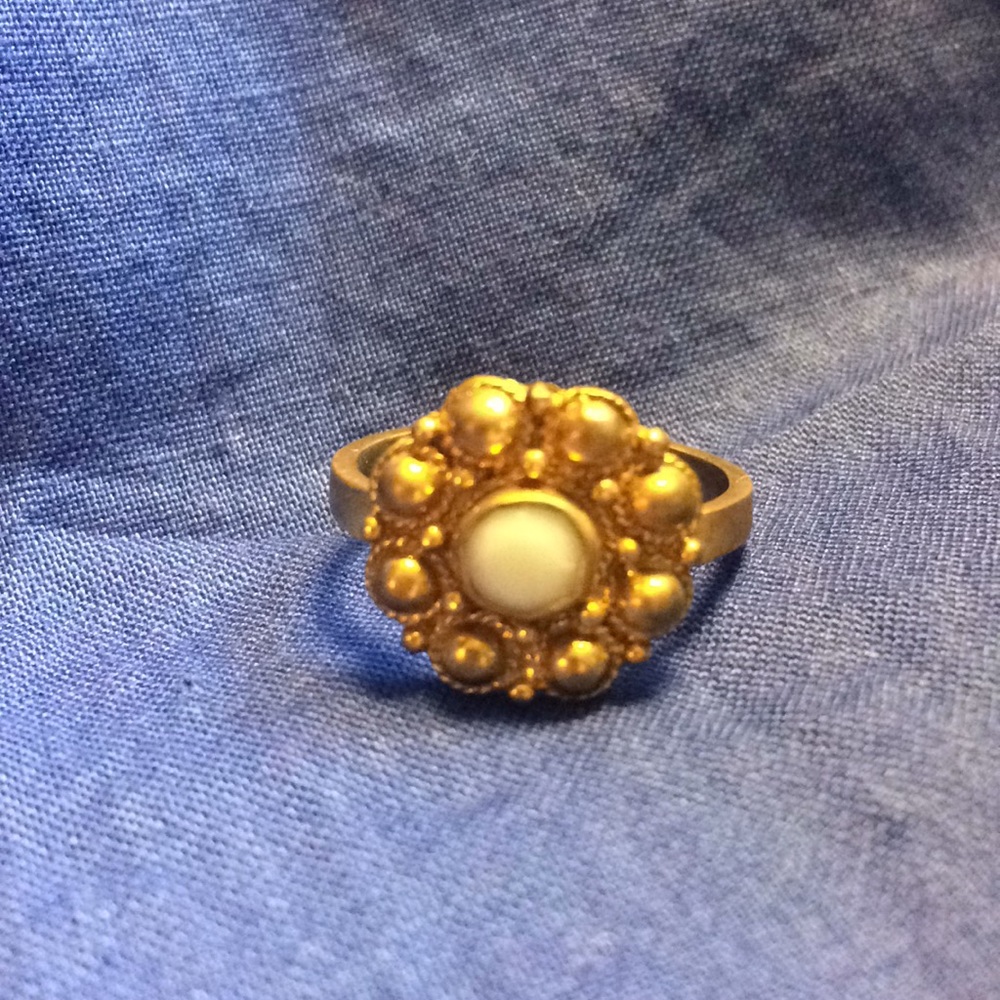 BR gold tone ring with white stone